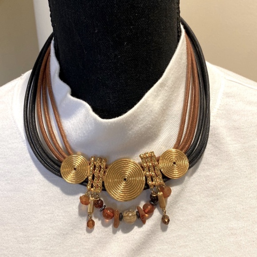 Gold colored leather and beaded necklace with gold medallions.